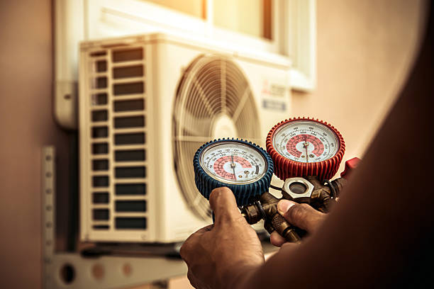Professional Hvac technician working in New Town, ND
